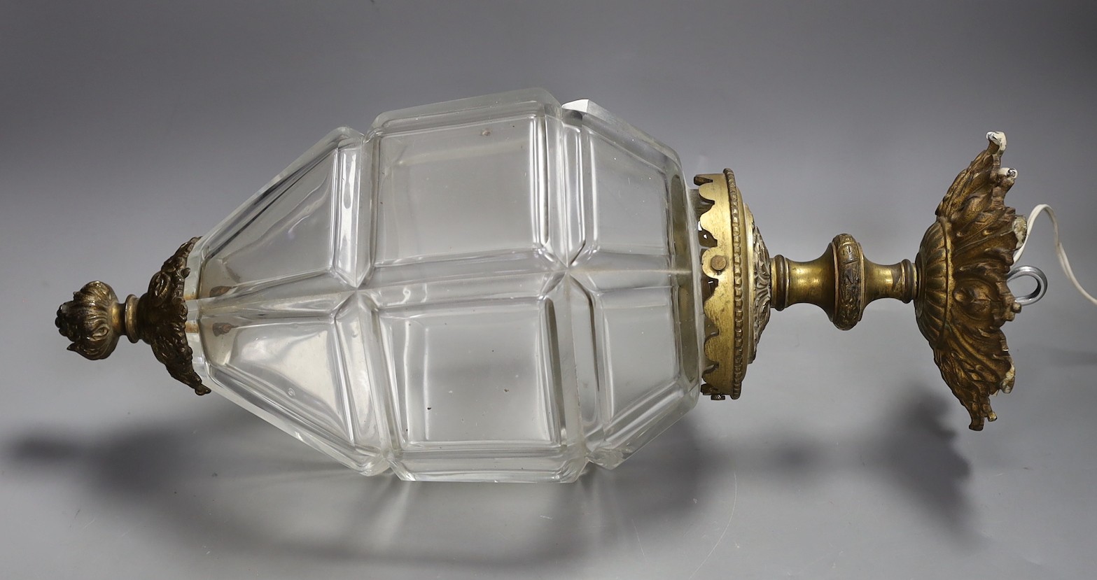 A gilt brass and panel cut glass hall lantern, 50cms